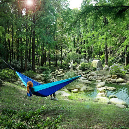 Solid color parachute hammock for two, includes hammock straps and black carabiner.